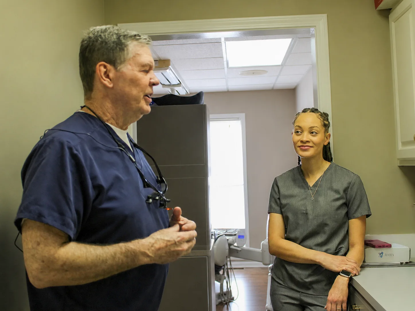 Dr. William Dellinger and Dr. Paris Little talking in the operatory at Clarity Dental in McDonough, Georgia
