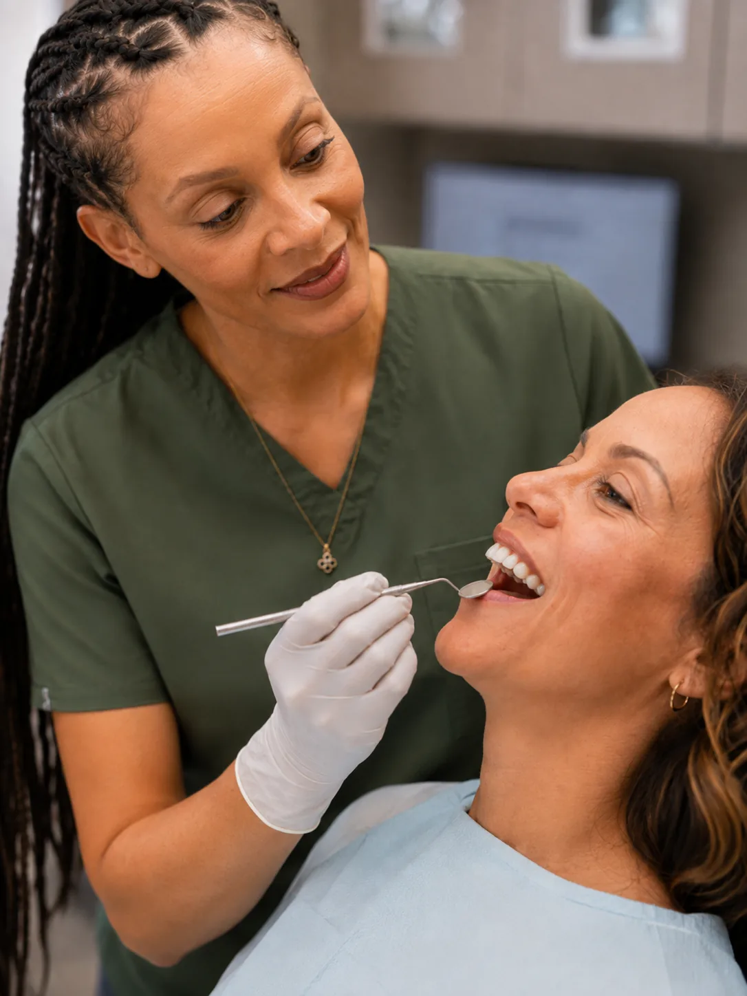 A patient smiling during a gentle dental exam with Dr. Paris Little at Clarity Dental in McDonough, Georgia
