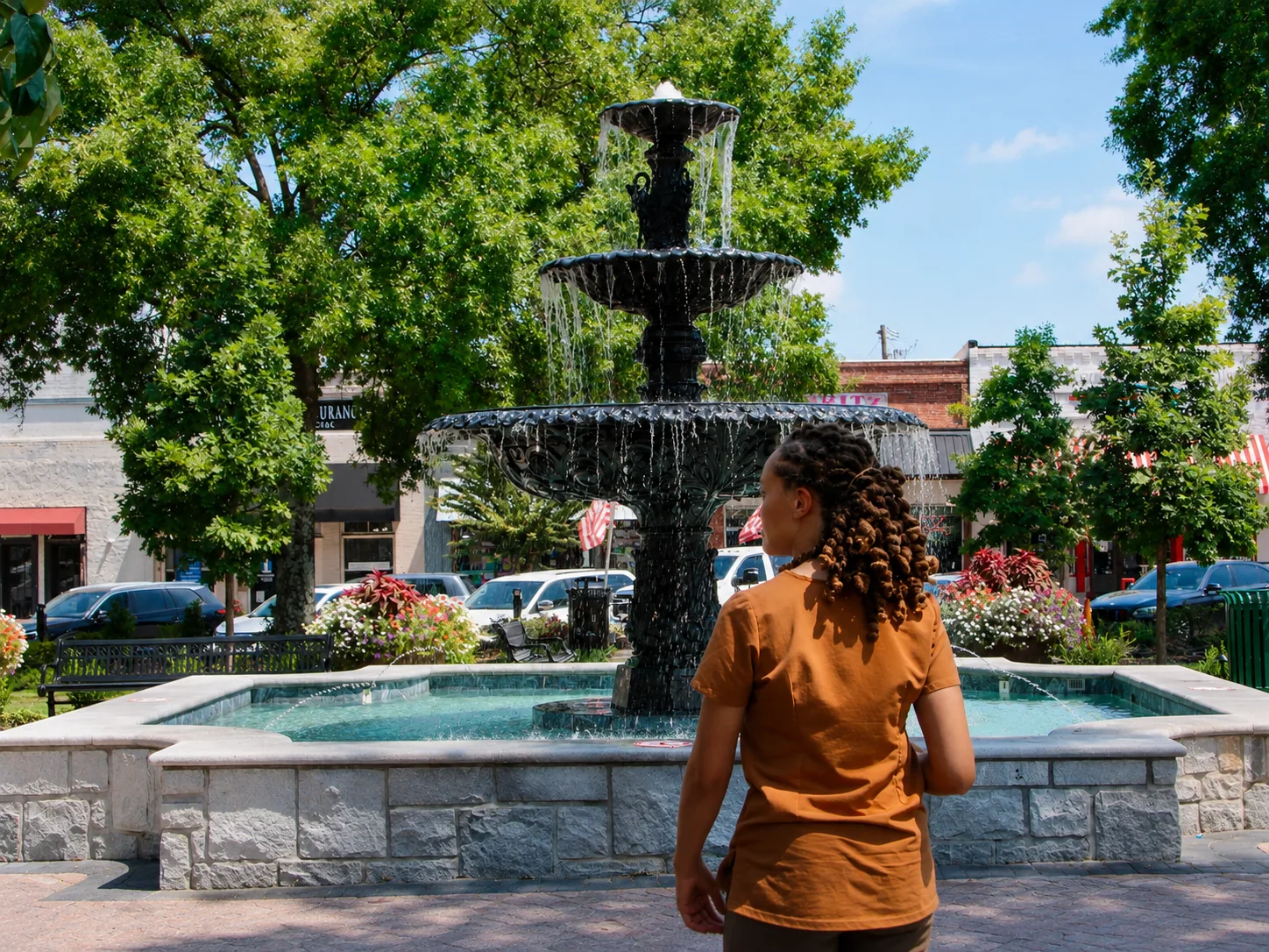 Dr. Paris Little taking in the fountain on the McDonough, Georgia town square