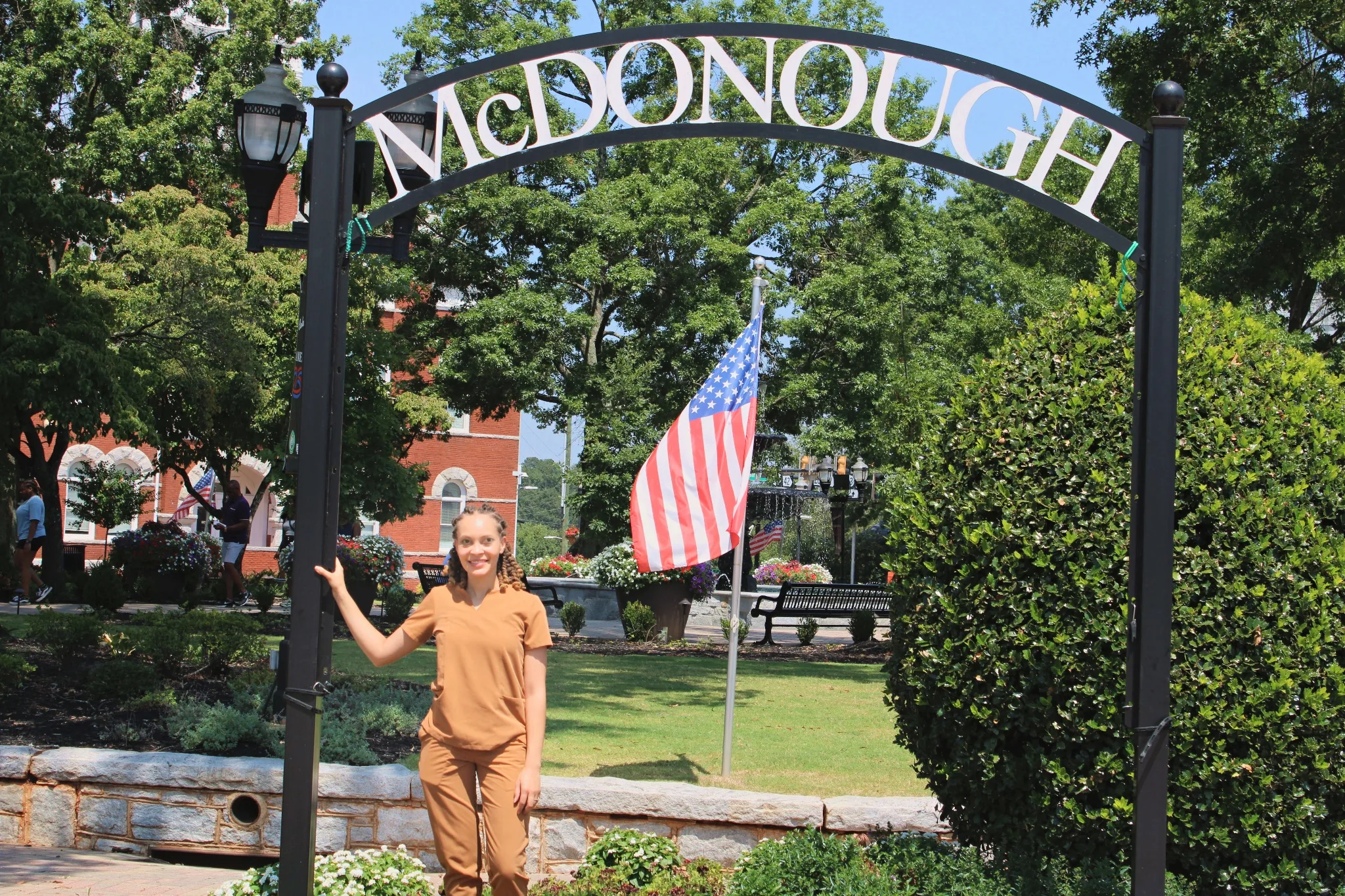 Dr. Paris Little under the McDonough town square arch in McDonough, Georgia