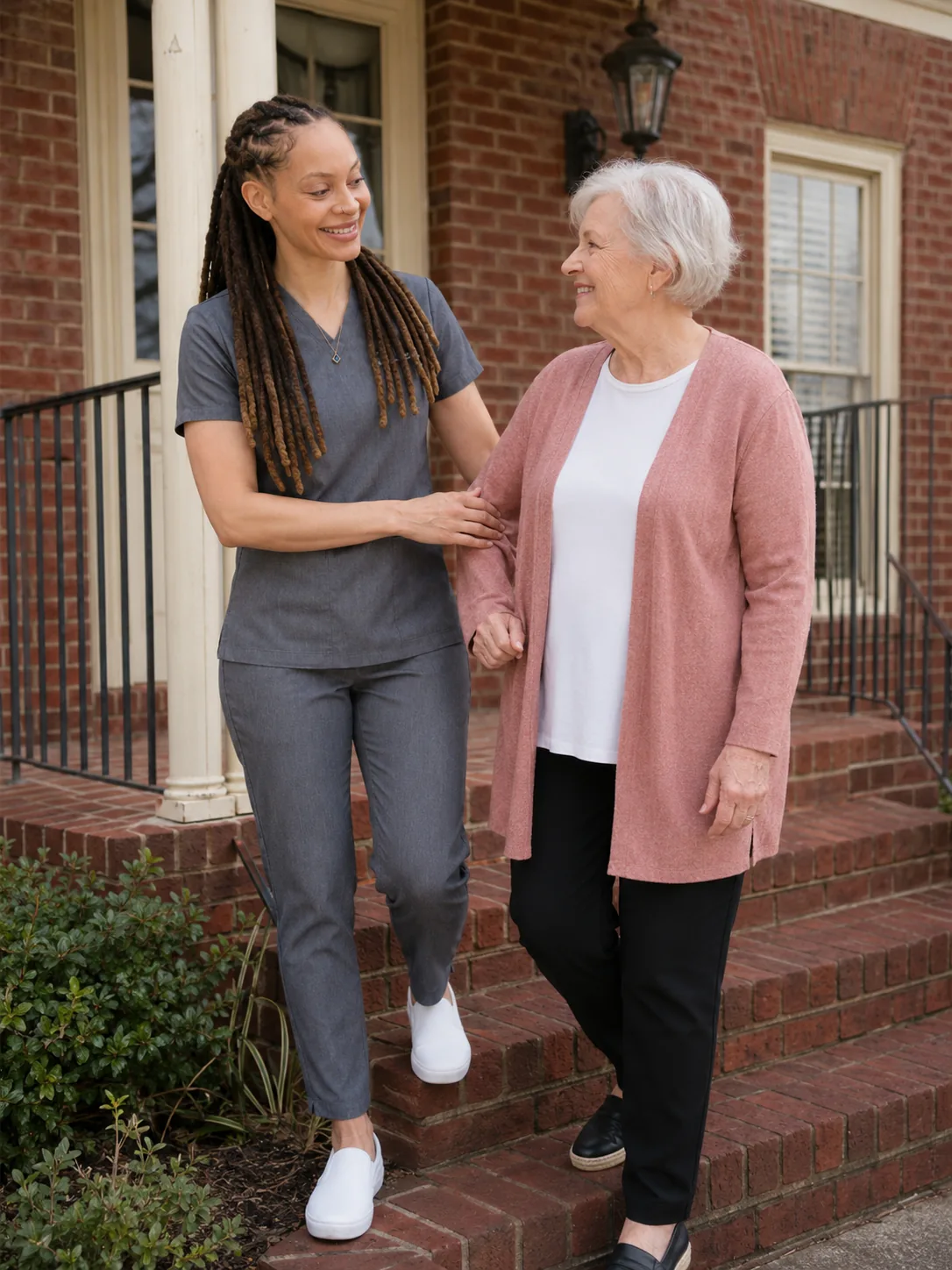 Dr. Paris Little walking a senior patient out after a visit at Clarity Dental in McDonough, Georgia