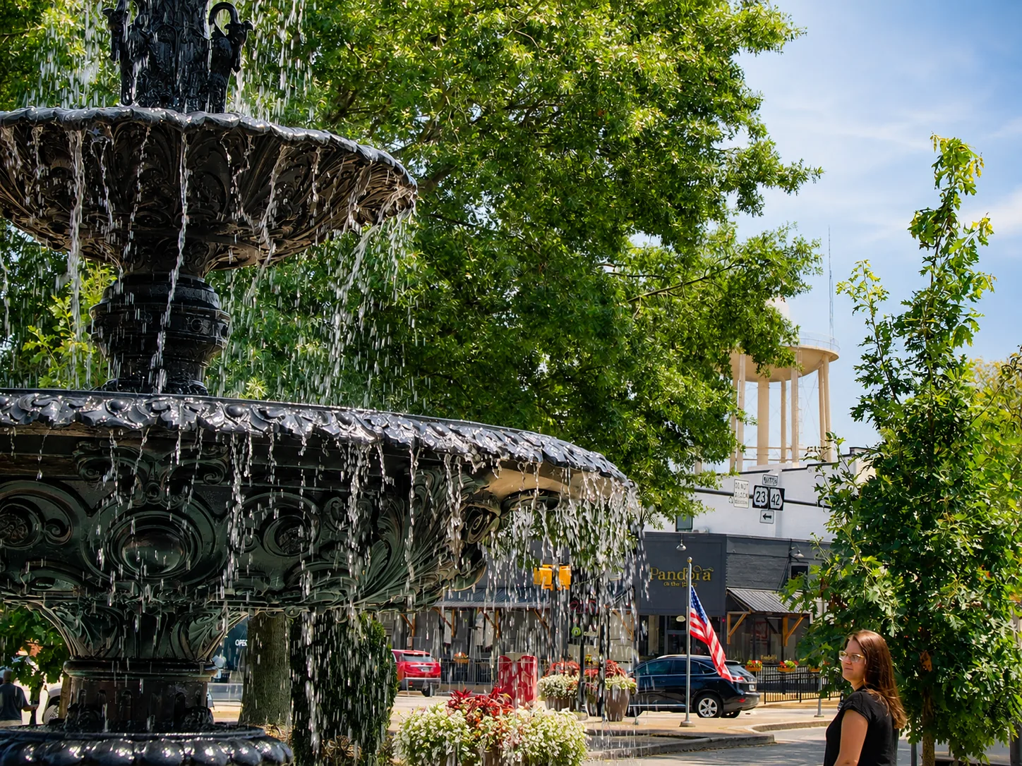 The McDonough, Georgia town square fountain with the city water tower in the distance