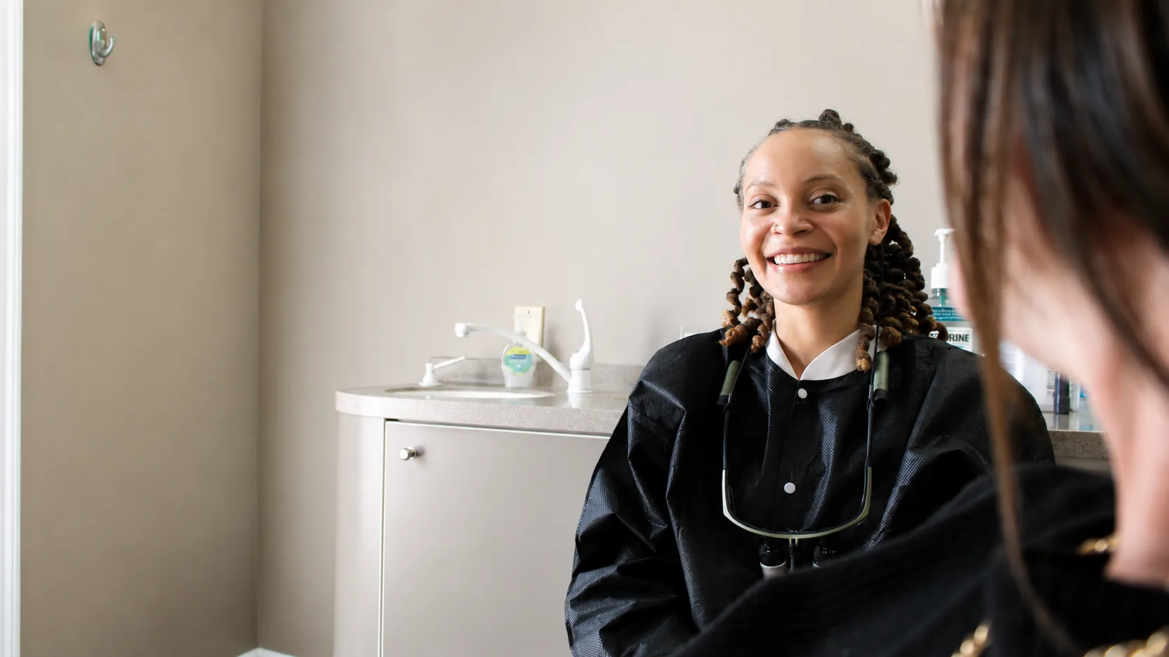 Dr. Paris Little smiling with a patient during a consultation at Clarity Dental in McDonough, Georgia
